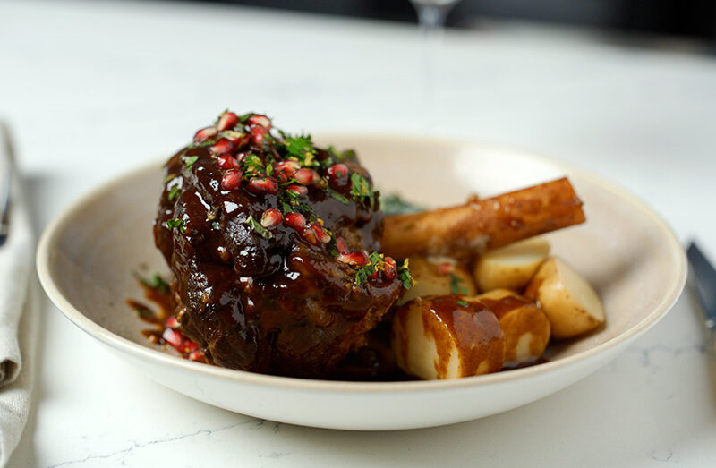 Pomegranate Glazed American Lamb Shank with Creamed Kale and Garlic Confit Potatoes